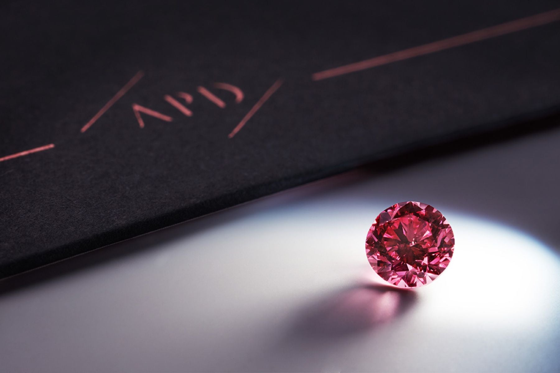 How are pink diamonds graded?